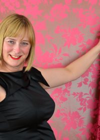 Chubby housewife plays with her big, perky tits in front of a camera