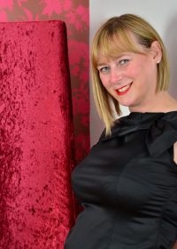 Chubby housewife plays with her big, perky tits in front of a camera