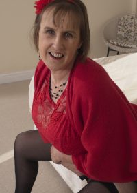 Mature, busty housewife gets it on when left alone in her home